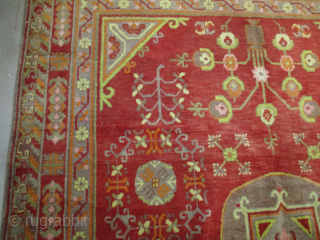 Vintage Khotan Oriental Rug 5’1” X 7’1” #8176 This circa 1920-1930 Khotan measures 5’1” X 7’1”. It has a single medallion containing a square and a flower and some hook figures on  ...