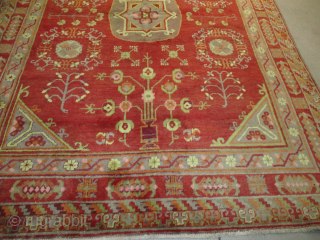 Vintage Khotan Oriental Rug 5’1” X 7’1” #8176 This circa 1920-1930 Khotan measures 5’1” X 7’1”. It has a single medallion containing a square and a flower and some hook figures on  ...