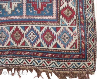 #6423 Shirvan Antique Caucasian Rug This circa 1870 Shirvan antique Oriental rug measures 4’0’ X 6’0’. It has fifteen panels with red and white medallions containing cross bars of ivory/blue , ivory/red  ...