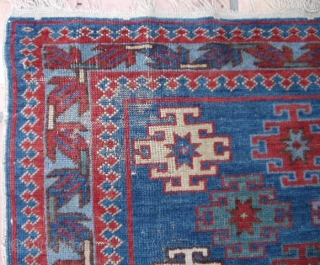
#6471 Kuba Antique Caucasian Rug 
This 19th century antique   Kuba measures 3’9” X 6’4”. It has latch hook medallions in red, ivory, yellow, green and pale blue on a medium  ...