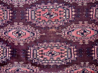 An antique part silk Saryk chuval, 165 x 89 cm. ( 5.4ft x 2.9ft) circa 1880. The dark purple-brown ground with Salor Guls. Each Gul inlaid with magenta silk and white cotton  ...