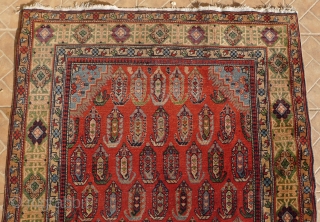 An antique  Chila Shirvan rug, Baku region, SE Caucasus. 6.7ft x 4 ft. Around 1900. The design with a small stepped ivory medallion, surrounded by boteh motifs on a red madder  ...