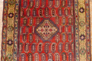 An antique  Chila Shirvan rug, Baku region, SE Caucasus. 6.7ft x 4 ft. Around 1900. The design with a small stepped ivory medallion, surrounded by boteh motifs on a red madder  ...