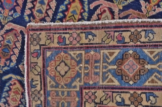 A Chila-Baku rug, Shirvan region, early 20 th. century. 
Size 4.1ftx6.6ft. (125 x 203 cm.)
Typical sky blue stepped medallion, surrounded by multi-coloured "boteh" motif on a dark blue ground. Classic Kufic main  ...