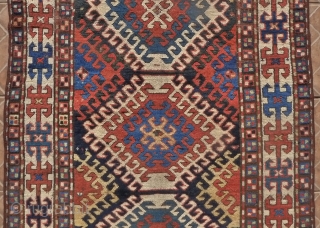 Kazak Rug, Bordjalou region, SE Caucasus, 215 x 11 cm. (7.05ft x 3.7ft) Probably 3 rd. qtr. of 19 th century. The design with a column of latch-hooked diamonds on a dark  ...