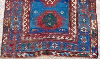 Bordjalou Kazak 215 x 112 cm (7.05ft x 3.7ft) with pre -1900 liveliness. The design with hooked diamonds and medallions on an abrashed blue ground. The field with animals, combs, herding sticks  ...