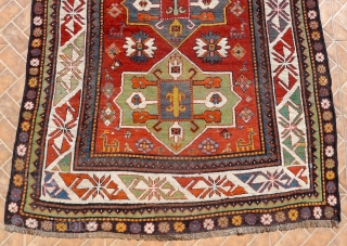 Outstanding Gendje/Bordjalou Kazak, 19th. century. The design with three "Akstafa" medallions in mint green and mid-blue. Each medallion with a central square and a typical Bordjalou "fleur-de-lis" motif.  Bold white ground  ...