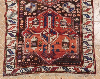 Kazak with Akstafa medallions, Bordjalou region.  124 x 240 cm. Around 1900. Nice condition with slight corrosion of the dark brown ground.          