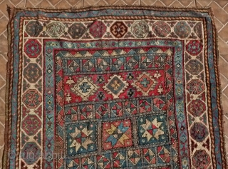 A Genje long rug with star design, late 19 th. century, 
Size:  306 x 120 cm. (10ft x 4ft.)
Inscribed in the right border and dated 1290 AH/ 1873 AD
A few areas  ...