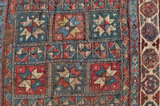 A Genje long rug with star design, late 19 th. century, 
Size:  306 x 120 cm. (10ft x 4ft.)
Inscribed in the right border and dated 1290 AH/ 1873 AD
A few areas  ...