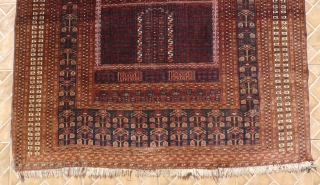 An antique Saryk Ensi, 5.25ft x 4.4ft, around 1900.  Type C class: main border with drooping blossoms, but without the inner meandering animal border. Good colours, mainly chocolate brown and blue-green. 