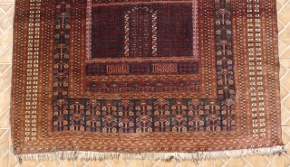 An antique Saryk Ensi, 5.25ft x 4.4ft, around 1900.  Type C class: main border with drooping blossoms, but without the inner meandering animal border. Good colours, mainly chocolate brown and blue-green. 