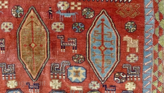 An antique Salyan Shirvan rug, SW Caucasus. 185 cm x 125 cm. This extraordinary and charismatic rug shows a central Fachralo medallion, flanked by four Akstafa peacocks. Three hexagonal Bordjalou shield motifs  ...