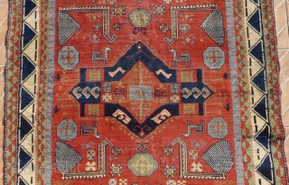 An antique Salyan Shirvan rug, SW Caucasus. 185 cm x 125 cm. This extraordinary and charismatic rug shows a central Fachralo medallion, flanked by four Akstafa peacocks. Three hexagonal Bordjalou shield motifs  ...