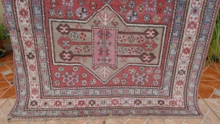 Antique Gendje rug, 6.7ft x 3.8ft. around 1910. Three octagonal medallion type, surrounded by flowerheads and two Akstafa peacocks. Nice mellow pistache geen medallions. However, the pink and a faded purple blue  ...
