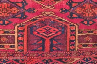 Saryk Kejebe Torba, 114 x 36 cm. 19 th. c. The design with 5 pairs of kejebe arches on a dark violet-red ground.
No multiple sub borders. Simply one main border, framed by  ...