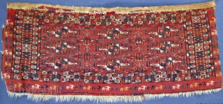 Finely woven Tekke Mafrash with wonderful goat procession border;
beautiful natural color spectrum, highlights in ruby silk;
pile is acceptably evenly low!
early 19th. century, 28" X 11"[71 X 28cm]      