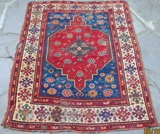 Dazkiri rug, 18th. century, beautiful colors including an intense aubergine, good pile with some damaged areas, alternating warp clusters of red and green, supple handle, 56" X 44"[142 X 111cm]   