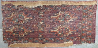 Important and beautiful very finely woven early Turkmen Khalyk fragment;
glorious colors set off by the deep aubergine ground.  Piece is lacking
the bottom appendages and the border on the right side which  ...