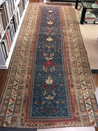 Shirvan runner, missing the bottom borders, cut and shut, a few holes.  Cleaned and stabilized.  All good colours.  A lot of rug for the money, maybe even worth more  ...