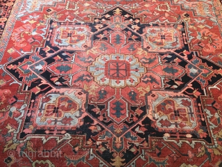 Antique Persian Heriz Circa 1900. Measures 9'-7" x 12' . Low even flat pile shows wear no tear or holes, both ends are intact.         