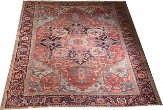 Antique Persian Heriz Circa 1900. Measures 9'-7" x 12' . Low even flat pile shows wear no tear or holes, both ends are intact.         