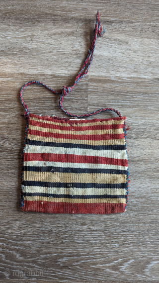  A Dynamic finely woven small Afshar chanteh (personal bag) from E.Persia, circa 1900 or before in soumak weave. It has a beautiful range of all-natural dyes, with a wonderful multi-color original  ...