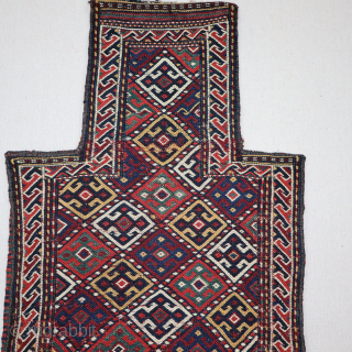 This is a fine Kurd salt bag from the late 19th century, E. Persia, with fantastic all-natural dyes and a wonderful soumak weave. It's a complete piece with an original multicolored back.  ...