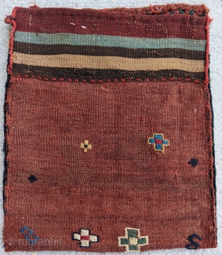 Lovely antique flat-woven chanteh (small personal bag), woven by a Kurdish tribe. Wonderful palette. Whimsical design flourishes on the back. Excellent condition with a full back. 43 x 36 cm.   