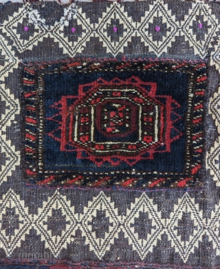 A fine Baluch chanteh, with mixed technique (piled knotting and various flatweave techniques). Silk highlights. Very uncommon. Good condition. Size: 13" x 13".          