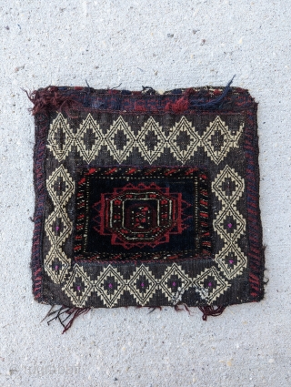 A charming and fine  Antique Baluch Chanteh(personal bag)with pink silk highlights, woven circa 1930 or before in W.Afghanistan or E. Persia. A unique textile with carpet and kilim mix, excellent condition,  ...