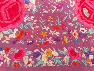 OLD SHAWL

5 1/2 foot square with 18" fringe containing diamond pattern.
Fushia silk crepe and silk knotted fringe
Covered with floral pattern with 12" and 6" diameter roses of 
hand satin stitch embroidery
2 1/2"  ...