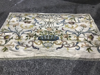 Mid 18th C Italian Textile

Floral cisele voided velvet pieces on cream silk. Silver metallic threads forming intertwined 
M A at top with a circle of stars. Velvet bowl at bottom with inset  ...