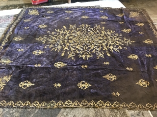 Late 19th C. Velvet Embroidery

Wall hanging of purple silk velvet with large floral bouquet worked in gold metallic thread. Small floral bouquets and single flower worked in gold metallic thread interspersed in  ...