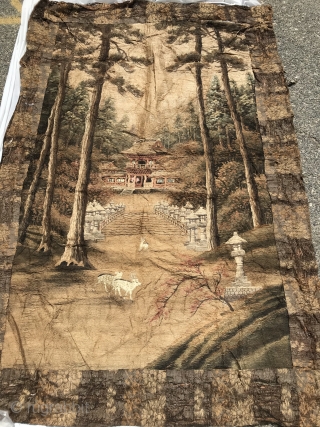 Japanese Embroidered Wall Hanging
Silk hand embroidery of pine forest and pagoda with two deer in foreground on hand-woven with supplemental weft background. 5” hand-woven geometric border. Orange brown brocaded floral and vine  ...