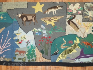 A rare American Hooked rug from the early part of the 20th century showing the southern part of the United States with various different type of animals.  Size is 3'x13' Condition  ...