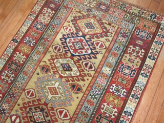 Antique Caucasian Shirvan Size 3'1''x8'3''.  Has been professionally repaired by an expert.  Rare golden yellow field!               