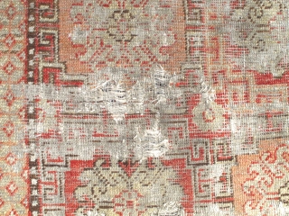 Khotan Rug, small format blossoms in lattice pattern with all natural colors. soft wool, evident wear and holes. Sourced recently in Tibet. 4"10' x 2'9" (146x81cm)       