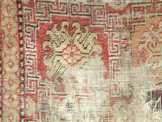 Khotan Rug, small format blossoms in lattice pattern with all natural colors. soft wool, evident wear and holes. Sourced recently in Tibet. 4"10' x 2'9" (146x81cm)       