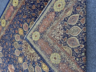 A Tabriz carpet with an 'Ardabil Carpet' medallion design, set against a blue foundation and complemented by red and yellow patterns on blue borders, often represents a beautiful and intricate piece of  ...