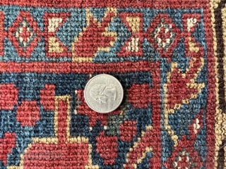 Bashir Rug with
palmette and pine leaf patterns red and blue ground
97” x 56” 8,56 
Condition , holes, repairs
               