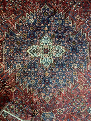 Antique Persian Joshagan Joshagan rug Joshogan (Joshagan), in central Persia specializes in only a few designs, especially one derived from Safavid originals, consisting of diamond or lozenge-shaped floret arrays, often around a  ...
