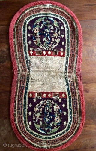 Early Tibetan saddle rug, aubergine ground and amazing Tang style medallions.                      