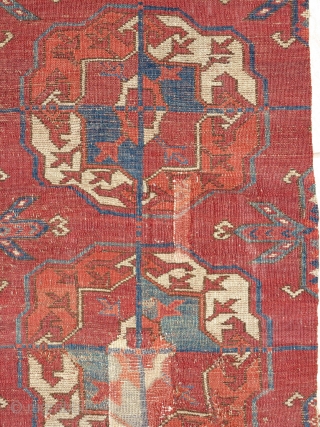 old Tekke Turkmen main carpet fragment from an early or mid century piece. A vertical strip with 10 guls representing the full vertical height of the field.  Several old and strange  ...