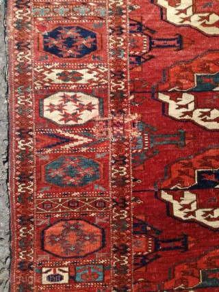 An antique Tekke main carpet  . 220/200 cm. Very old and Fine. Some repairs. Original size.                