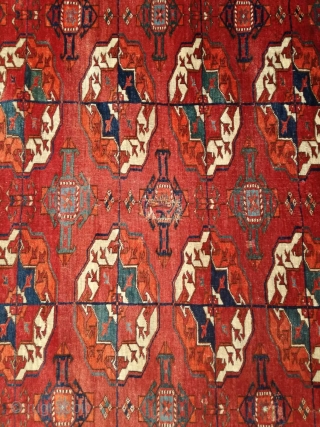 An antique Tekke main carpet  . 220/200 cm. Very old and Fine. Some repairs. Original size.                