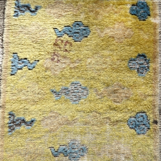Early Chinese Ningxia fragment with cloud design. Weft is white animal hair not cotton. Either part of a runner, or based on size, perhaps a seating square. Super soft wool with large  ...