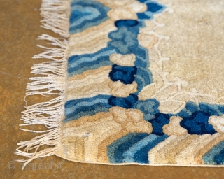 Antique Tibetan seat cover. This gorgeous seat cover features rainy skies and very soft, hand-spun natural wool.

width: 1'5"
length: 2'1"
size category: 3'x5' and smaller
dominant colors: rich Beiges & Blues     