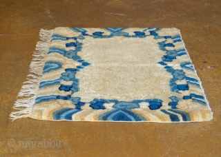 Antique Tibetan seat cover. This gorgeous seat cover features rainy skies and very soft, hand-spun natural wool.

width: 1'5"
length: 2'1"
size category: 3'x5' and smaller
dominant colors: rich Beiges & Blues     