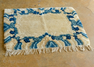 Antique Tibetan seat cover. This gorgeous seat cover features rainy skies and very soft, hand-spun natural wool.

width: 1'5"
length: 2'1"
size category: 3'x5' and smaller
dominant colors: rich Beiges & Blues     